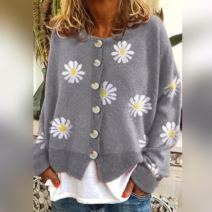 Women's floral knit cardigan with daisy motifs and button front