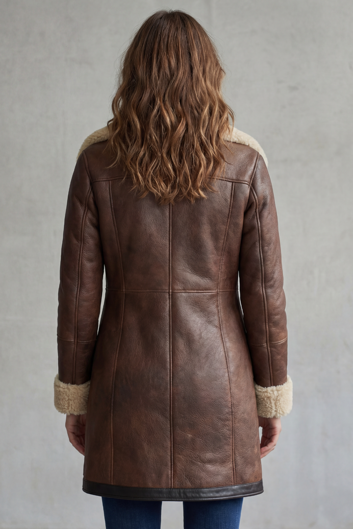 Women's long shearling-lined coat with wide collar and angled zip front