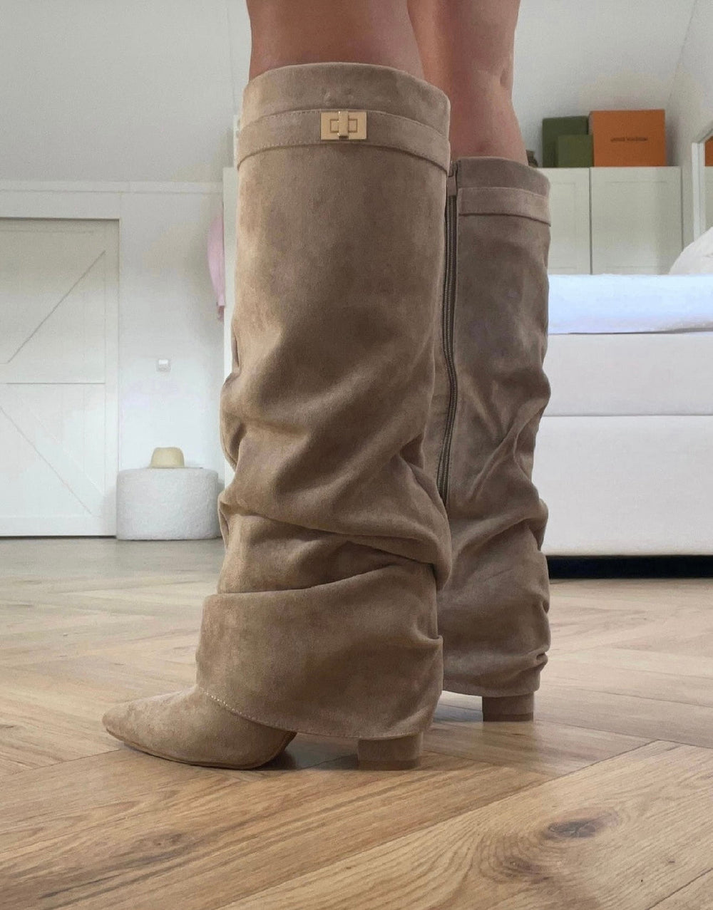 Women's beige slouch knee-high boots with pointed toes and low heels