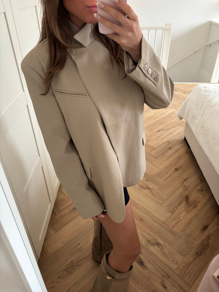 Women's beige blazer with high collar, long sleeves and button front
