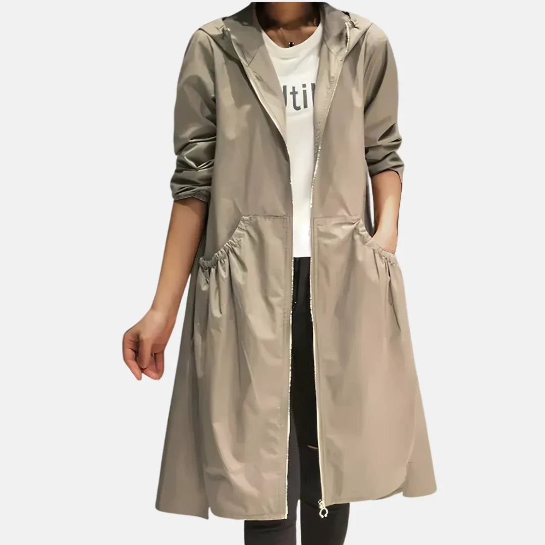 Women's hooded knee-length coat with front zipper and large angled pockets