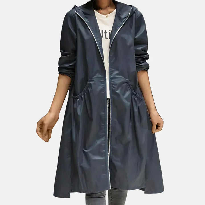 Women's hooded knee-length coat with front zipper and large angled pockets