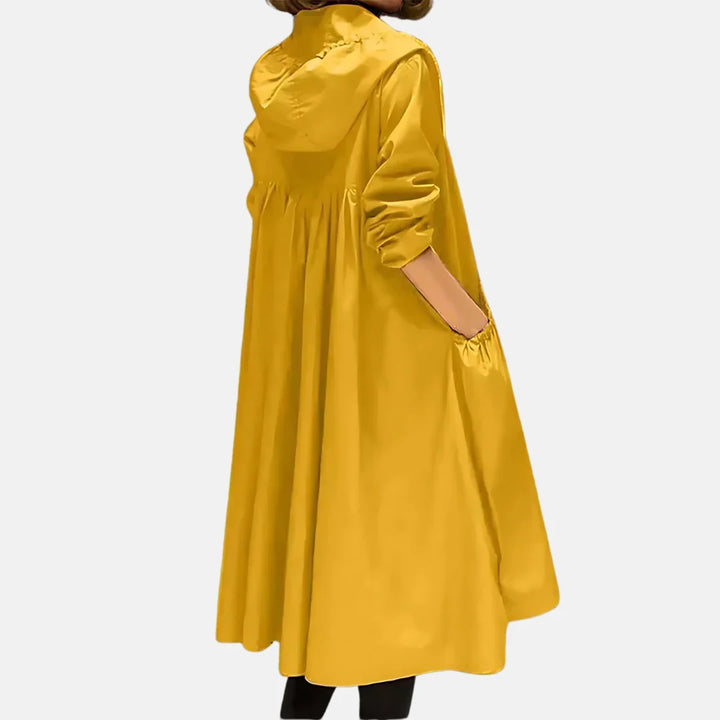 Women's hooded knee-length coat with front zipper and large angled pockets