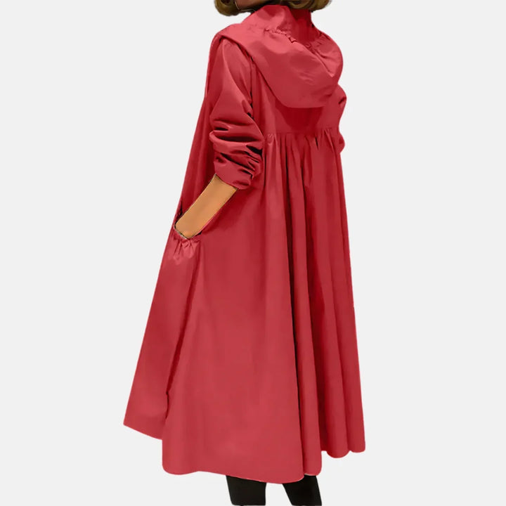 Women's hooded knee-length coat with front zipper and large angled pockets