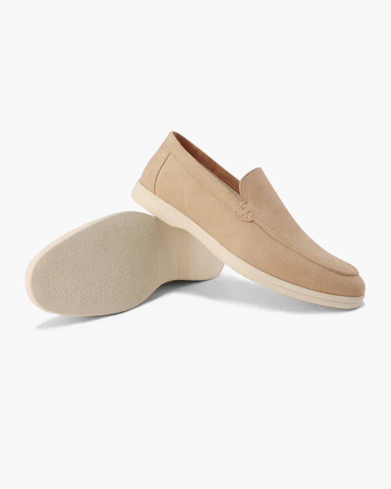 Women's slip-on loafers with moc-toe stitching and a raised wedge sole