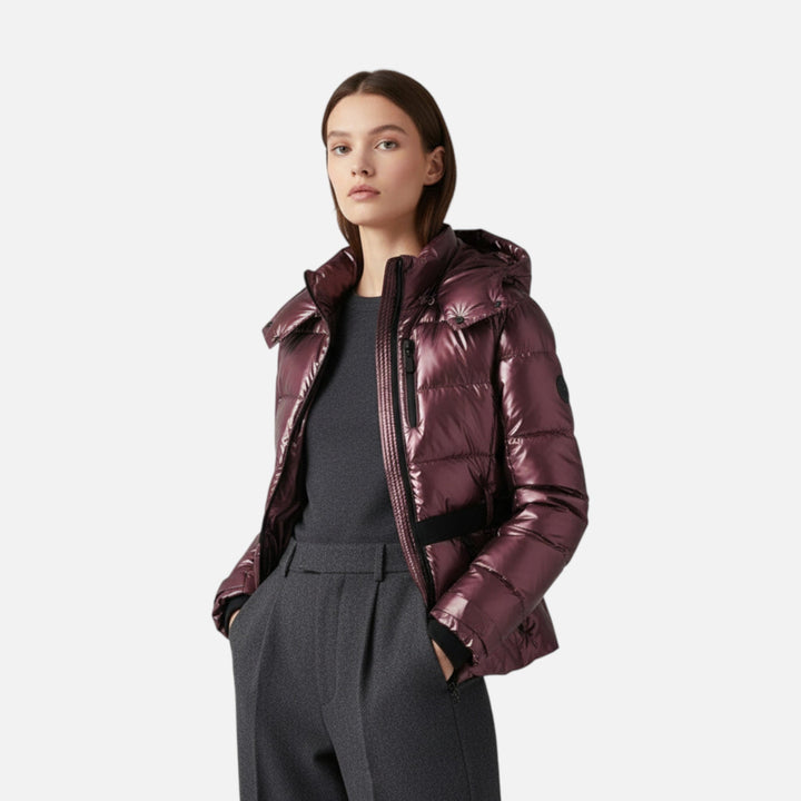 Women's hooded padded ski jacket with a belted waist and quilted panels