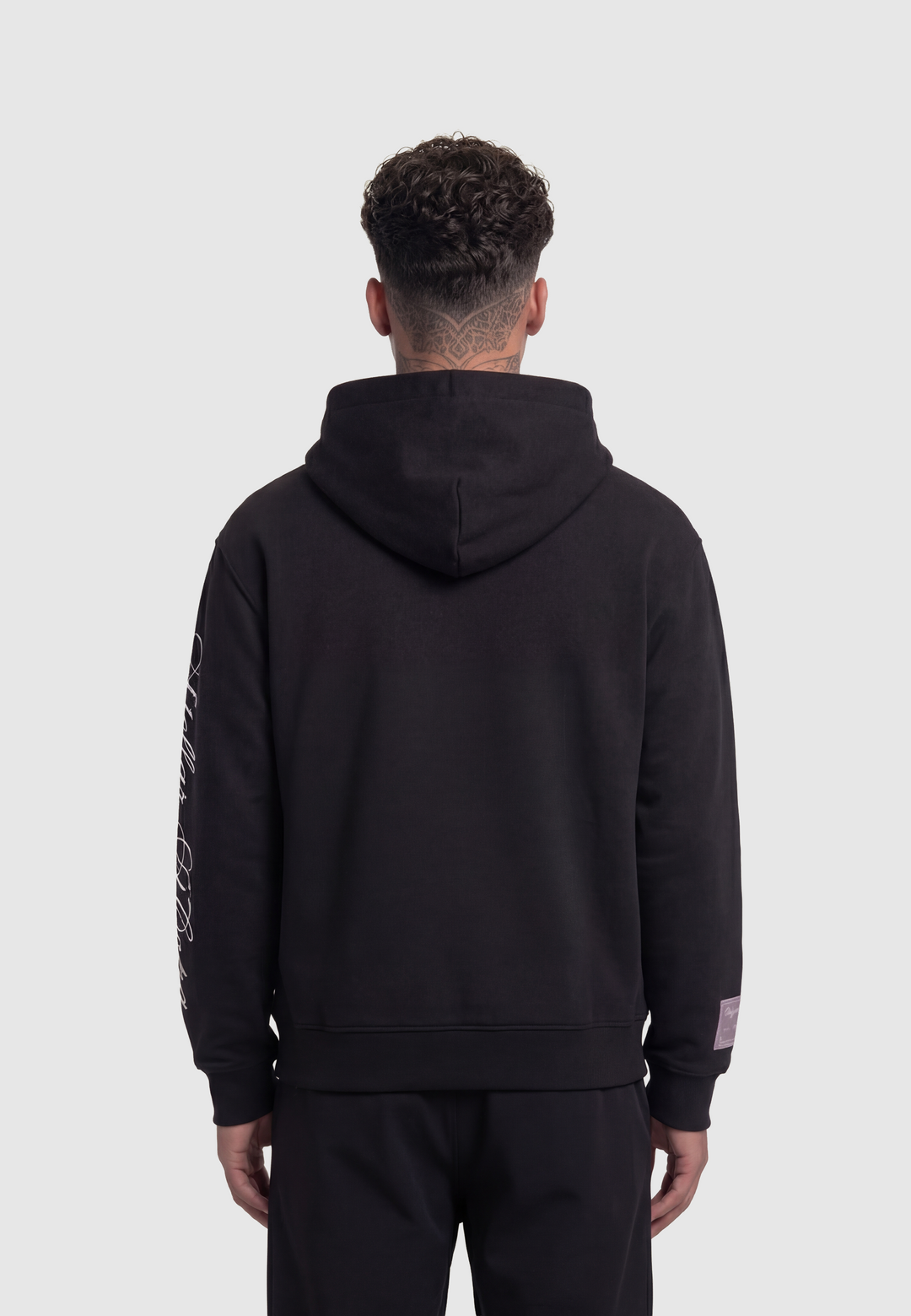 Black hooded sweatshirt with kangaroo pocket and white sleeve script