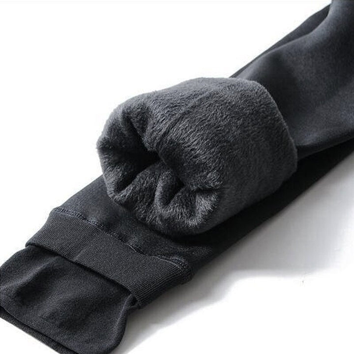 Women's high-waist plush-lined full-length leggings with enclosed foot sections