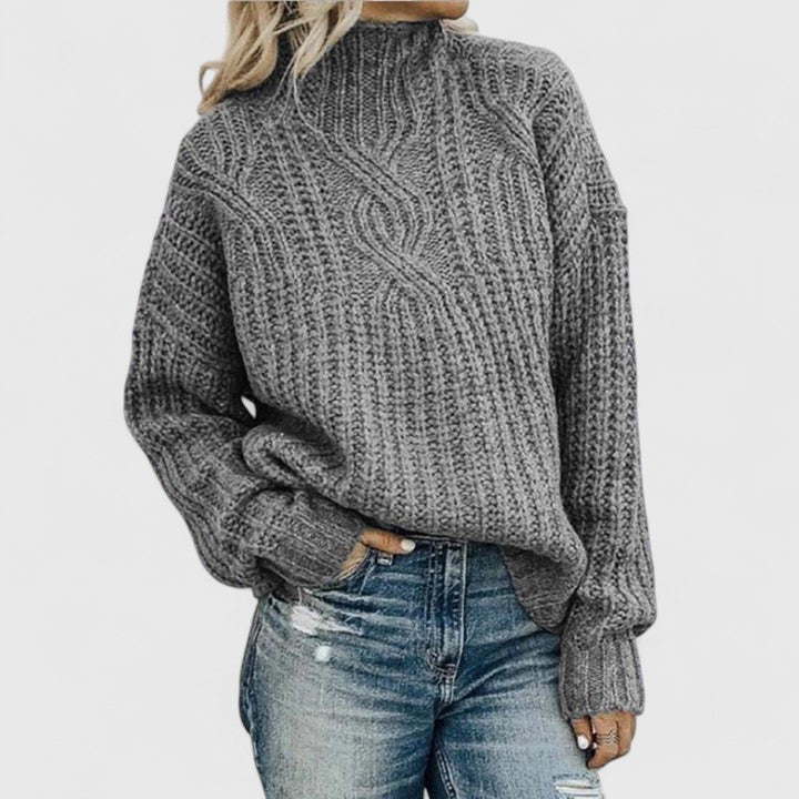 Women's cable knit sweater with high mock neck and long sleeves