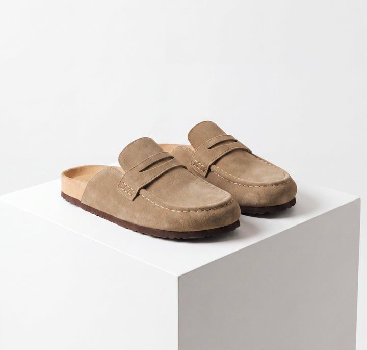 Women's beige loafer mule clogs with round toes and flat soles