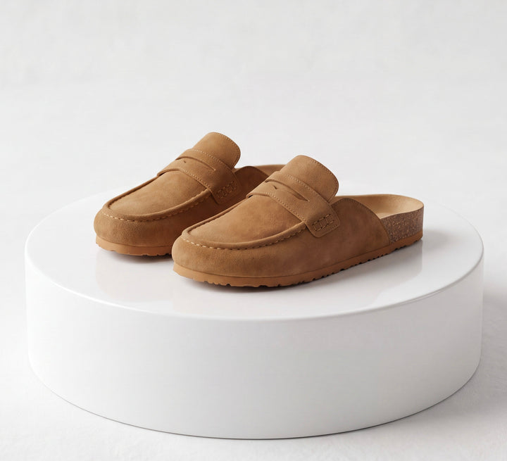 Women's brown flat loafer mule clogs with rounded moc toes and open backs