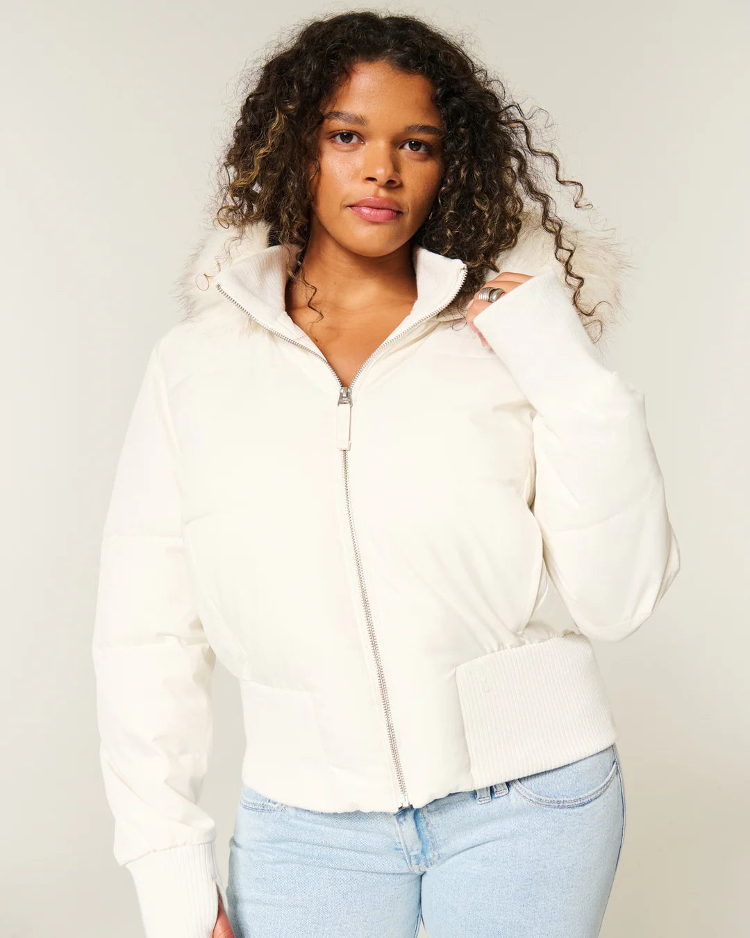 Women's hooded puffer jacket with fur-trimmed hood and zip front
