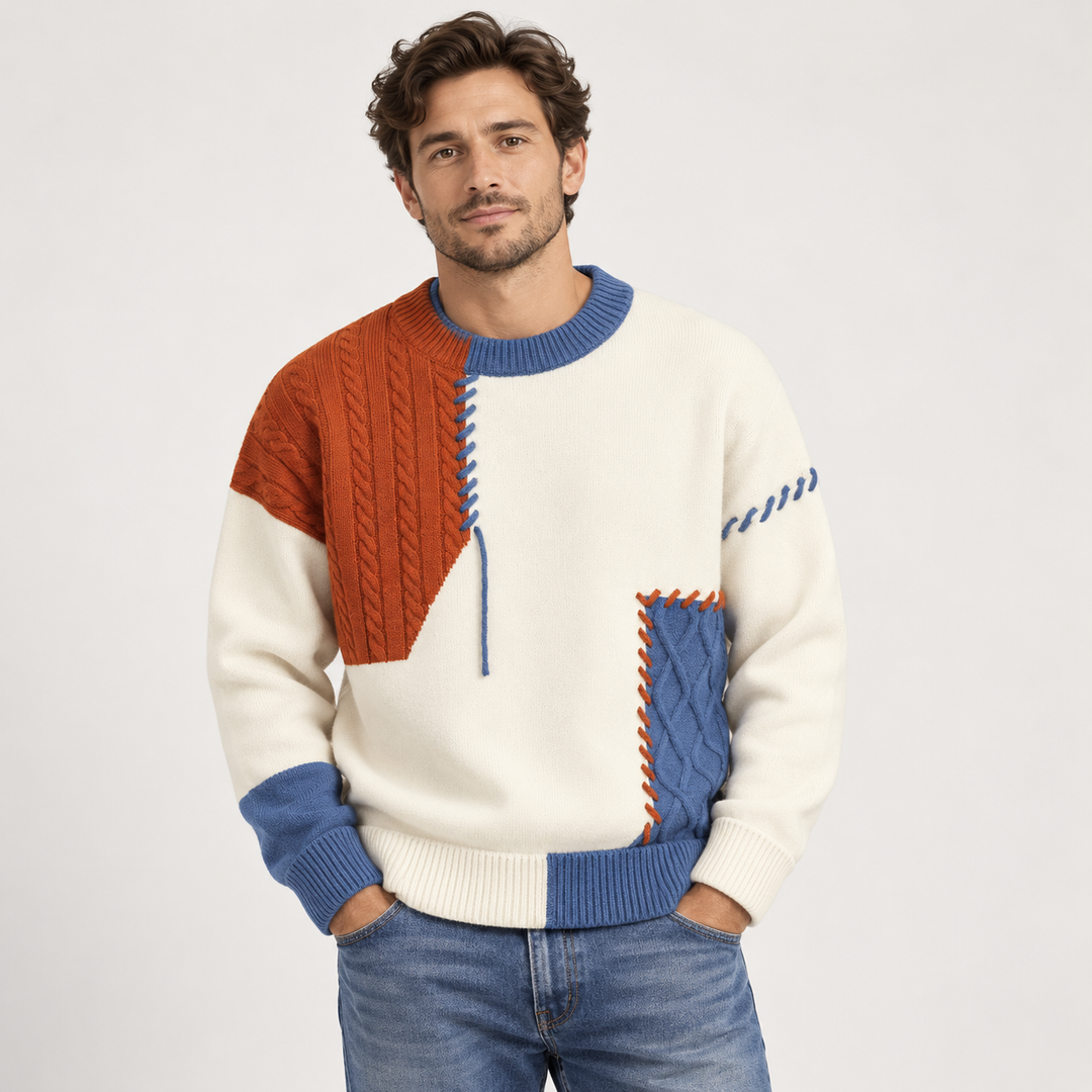 Women's patchwork cable knit sweater with crew neck and contrasting stitched panels