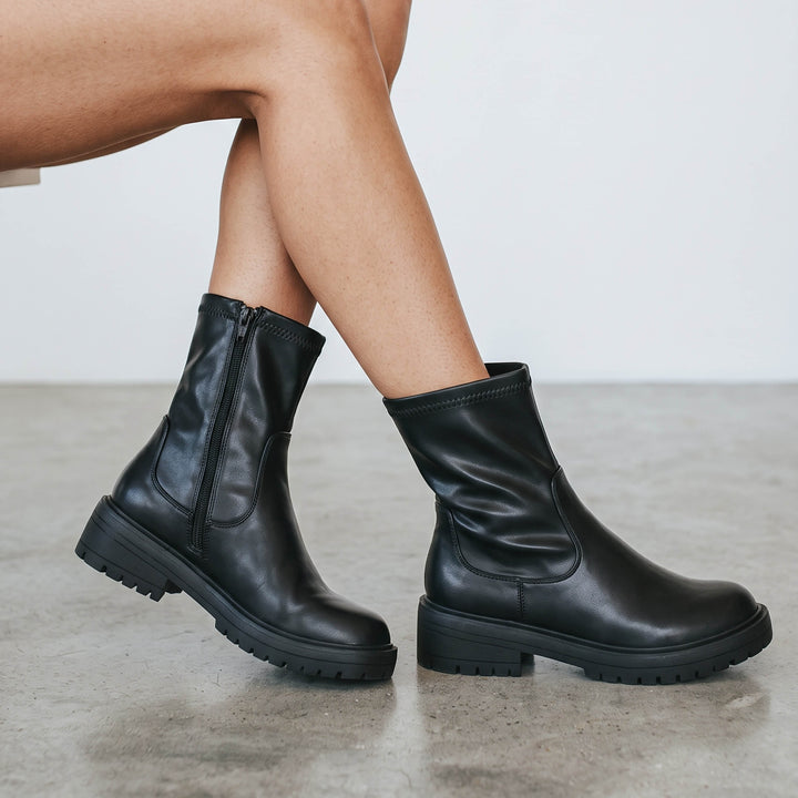 Women's black chunky biker ankle boots with side zips and lug soles