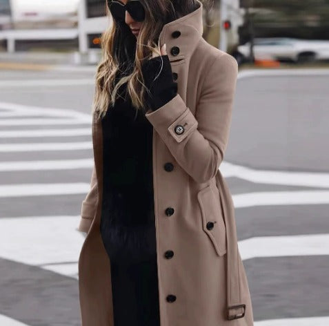 Women's knee-length button-front coat with stand collar, long sleeves, cuff straps and angled pockets