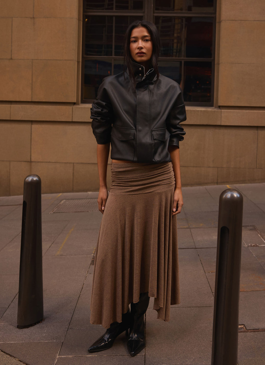 Women's black bomber jacket with mock neck, long sleeves and front flap pockets