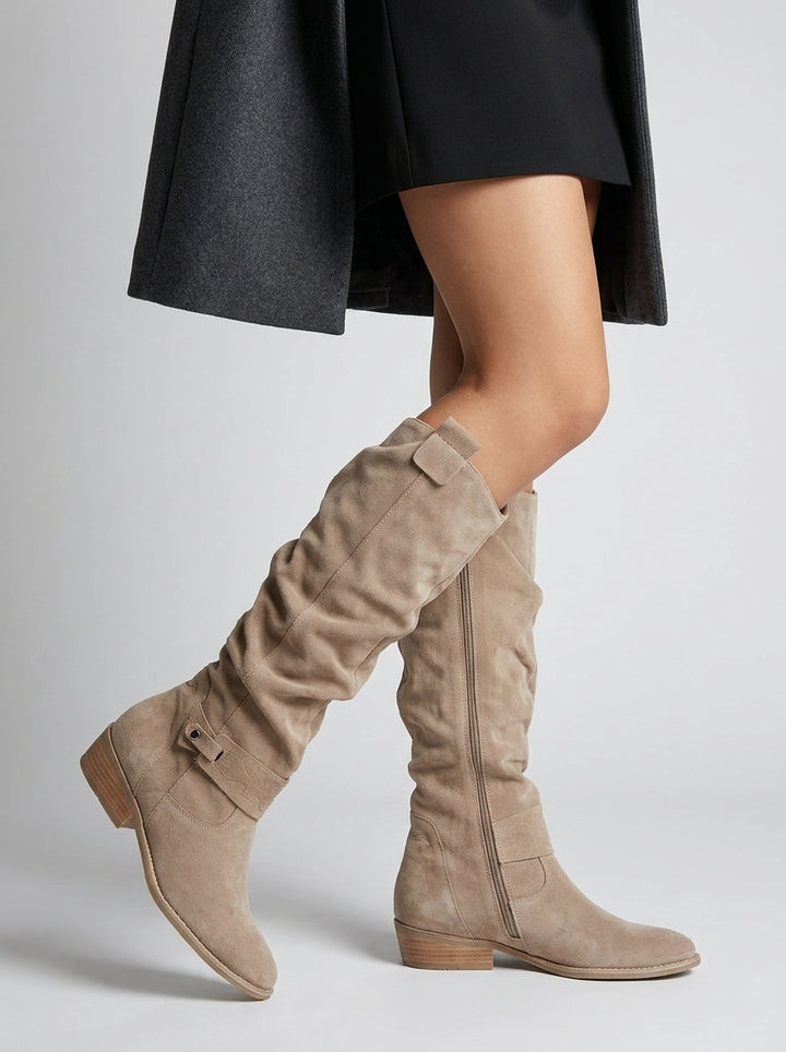 Women's knee-high boots with low block heels, side zippers and decorative straps