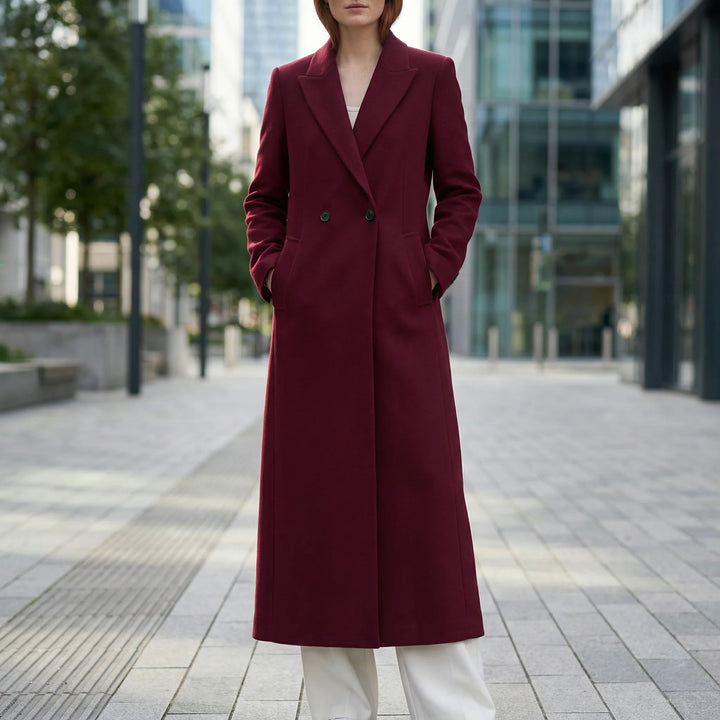 Women's long tailored coat with notched lapels, button front and flap pockets