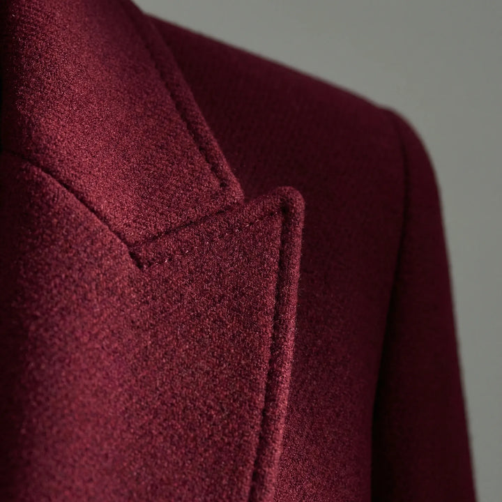 Women's long tailored coat with notched lapels, button front and flap pockets