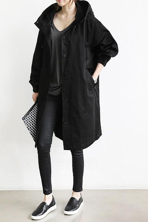 Women's long hooded trench coat with button front, elastic cuffs and side pockets