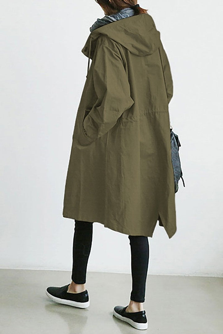 Women's long hooded trench coat with button front, elastic cuffs and side pockets