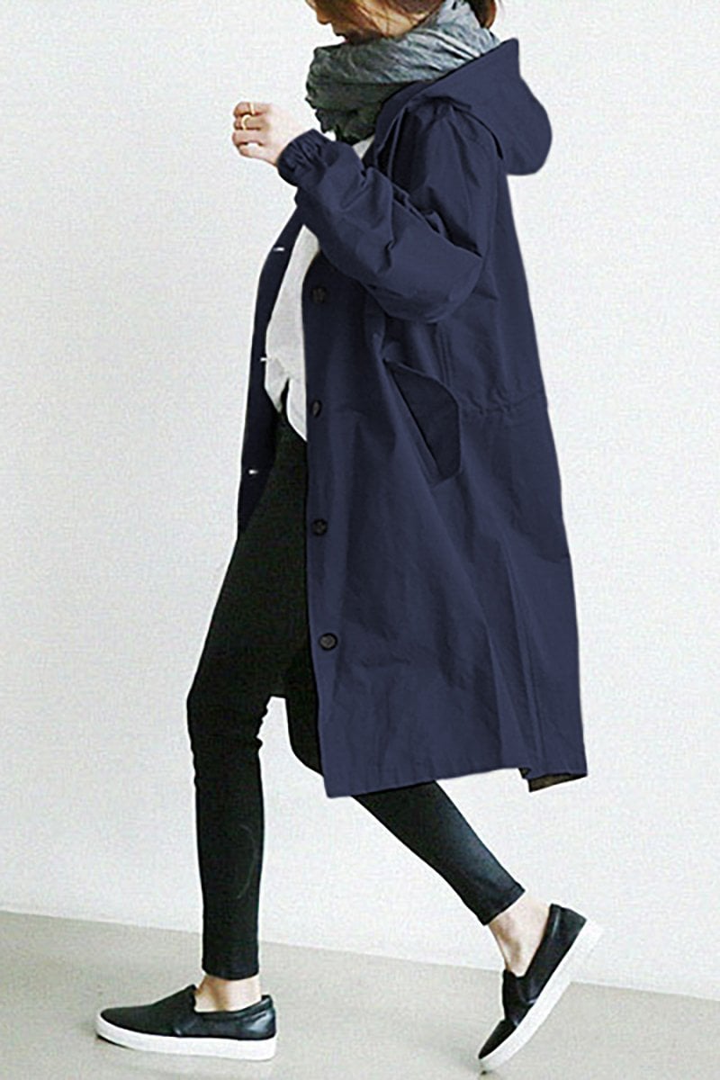 Women's long hooded trench coat with button front, elastic cuffs and side pockets