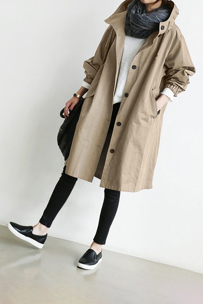 Women's long hooded trench coat with button front, elastic cuffs and side pockets