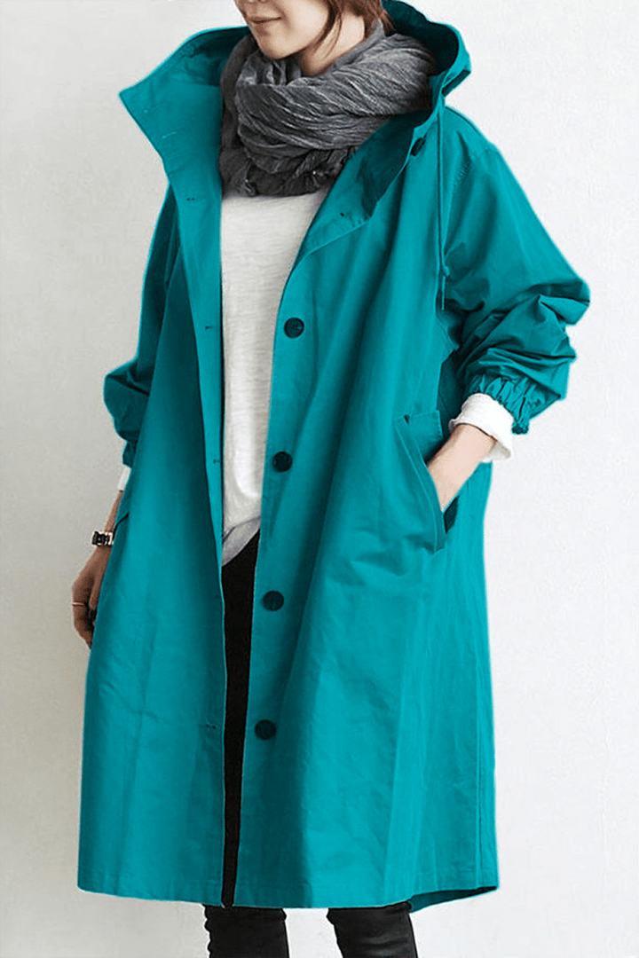 Women's long hooded trench coat with button front, elastic cuffs and side pockets