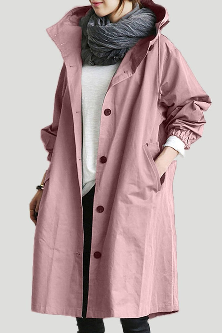 Women's long hooded trench coat with button front, elastic cuffs and side pockets