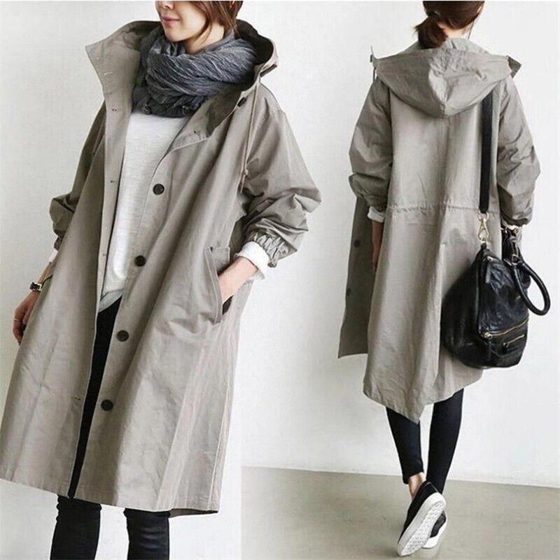 Women's long hooded trench coat with button front, elastic cuffs and side pockets