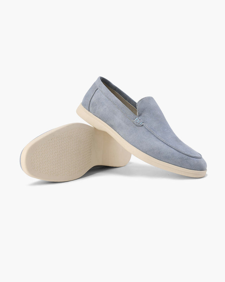 Women's slip-on loafers with moc-toe stitching and a raised wedge sole