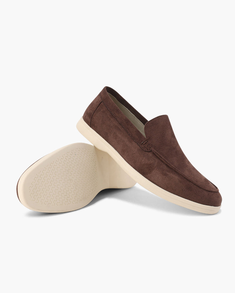 Women's slip-on loafers with moc-toe stitching and a raised wedge sole