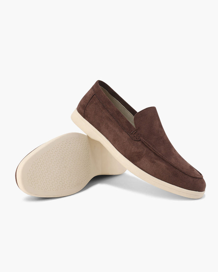 Women's slip-on loafers with moc-toe stitching and a raised wedge sole