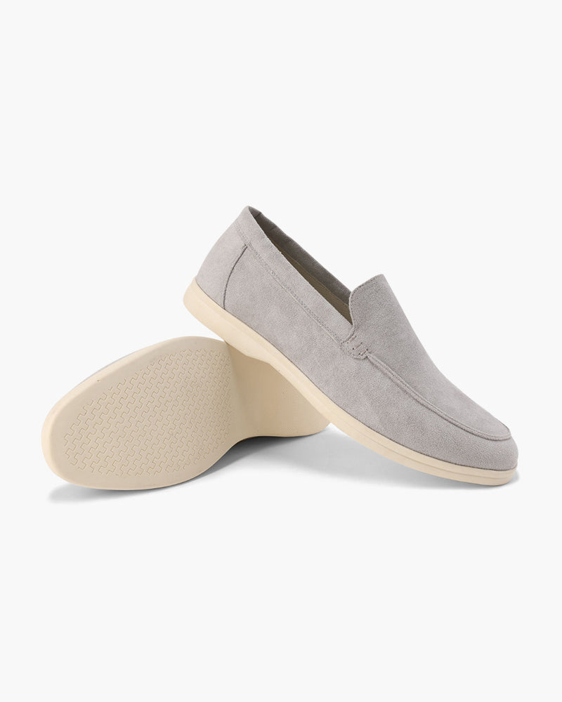 Women's slip-on loafers with moc-toe stitching and a raised wedge sole