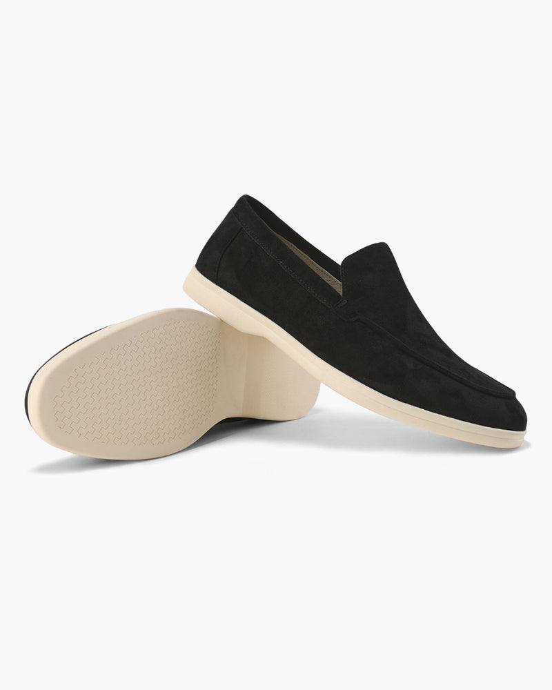 Women's slip-on loafers with moc-toe stitching and a raised wedge sole