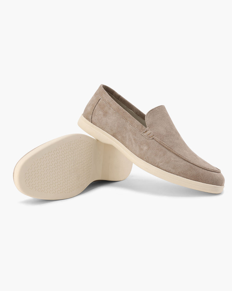 Women's slip-on loafers with moc-toe stitching and a raised wedge sole