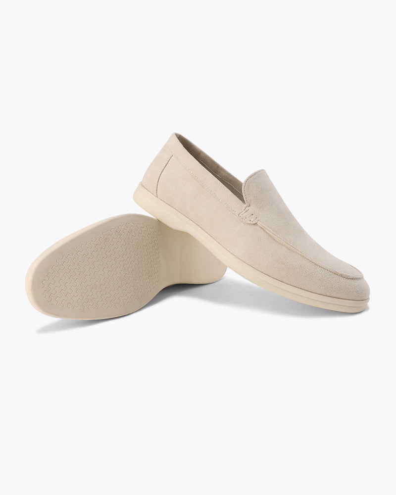 Women's slip-on loafers with moc-toe stitching and a raised wedge sole