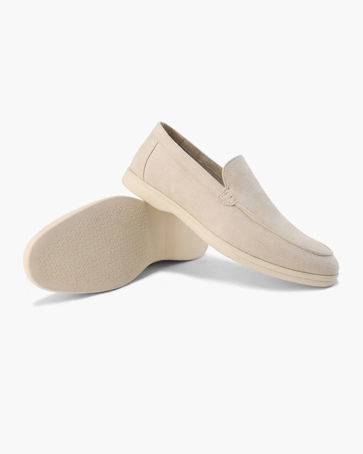 Women's slip-on loafers with moc-toe stitching and a raised wedge sole