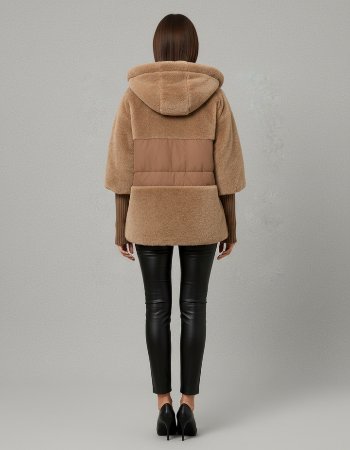 Women's hooded faux fur jacket with quilted panels and front pockets