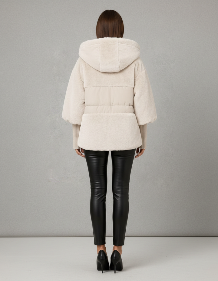 Women's hooded faux fur jacket with quilted panels and front pockets