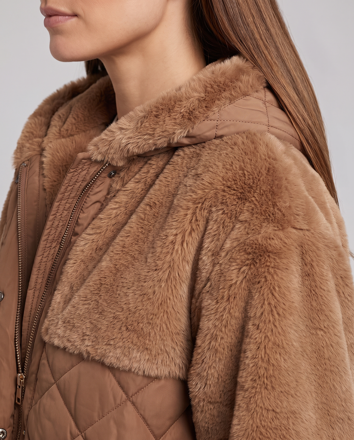 Women's hooded faux fur jacket with quilted panels and front pockets