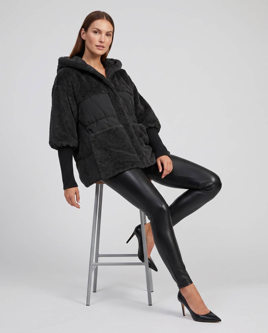 Women's hooded faux fur jacket with quilted panels and front pockets