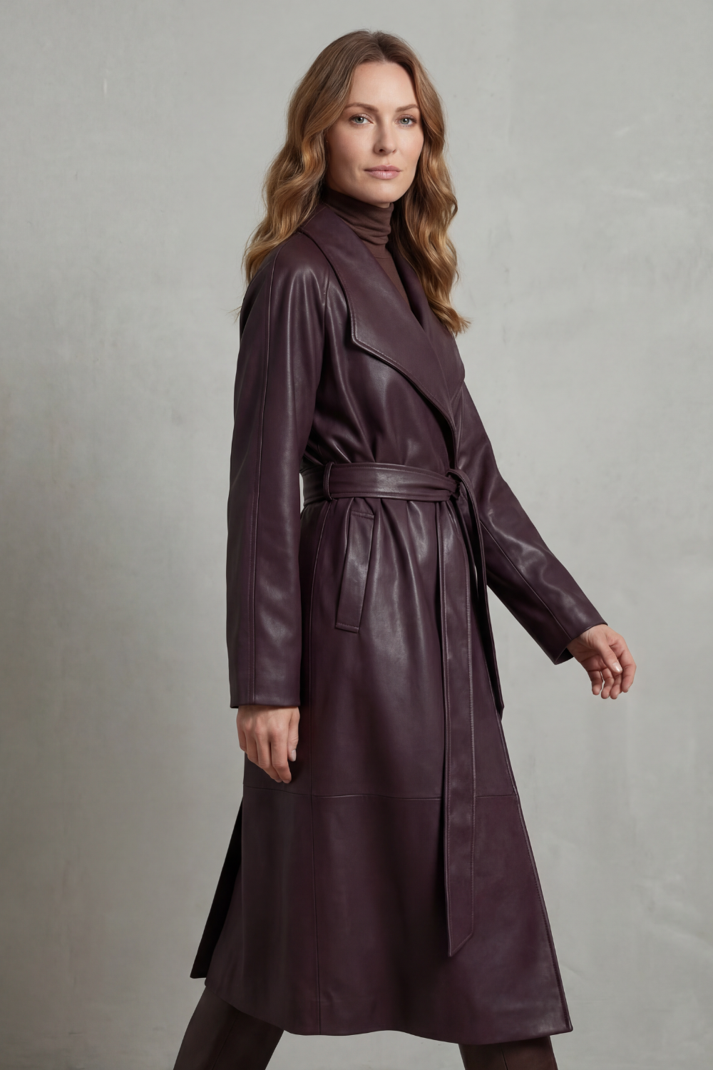 Women's longline belted trench coat with wide lapels and long sleeves
