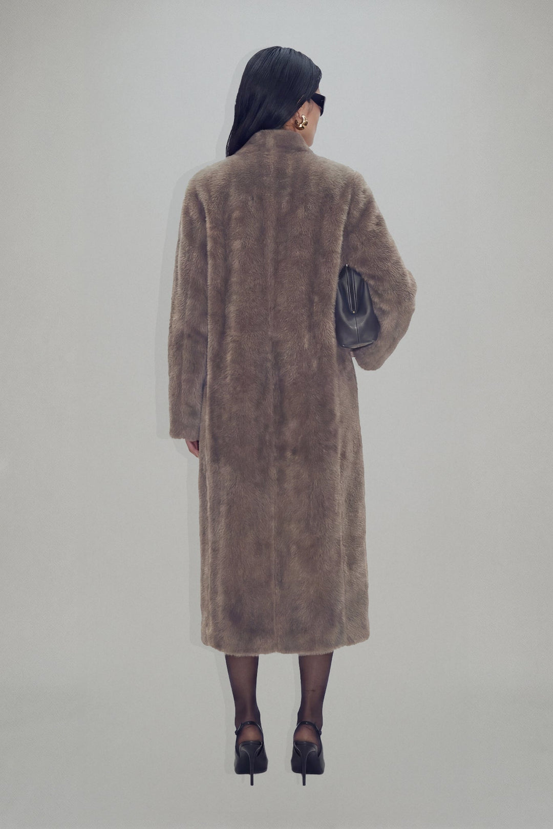 Women's brown textured long coat with long sleeves and mid-calf length