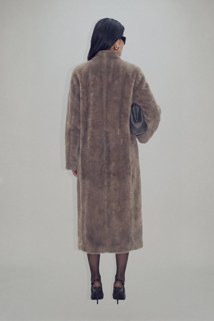Women's brown textured long coat with long sleeves and mid-calf length