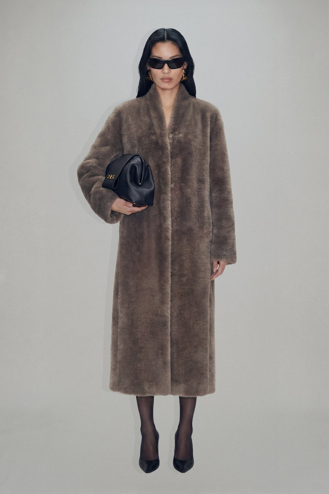 Women's brown textured long coat with long sleeves and mid-calf length