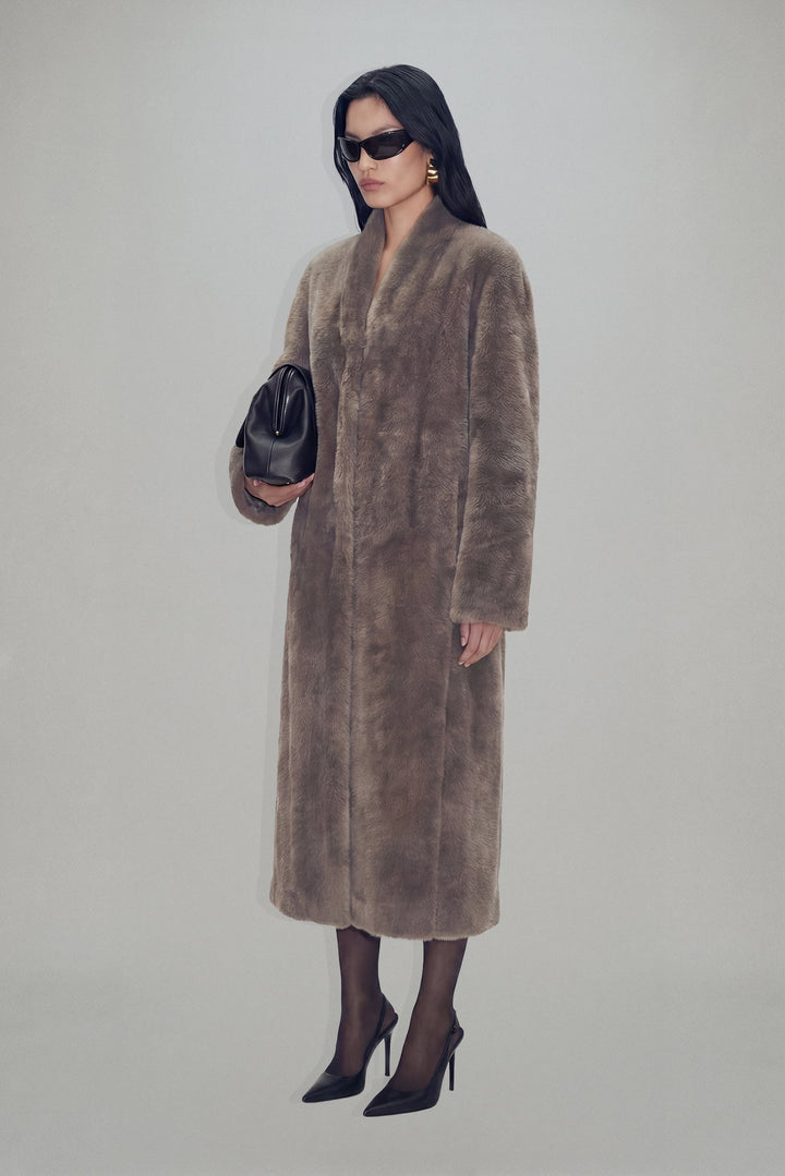 Women's brown textured long coat with long sleeves and mid-calf length