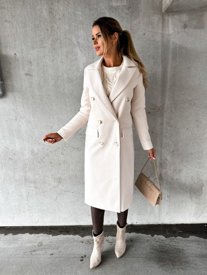 Women's long double-breasted coat with lapel collar and flap pockets