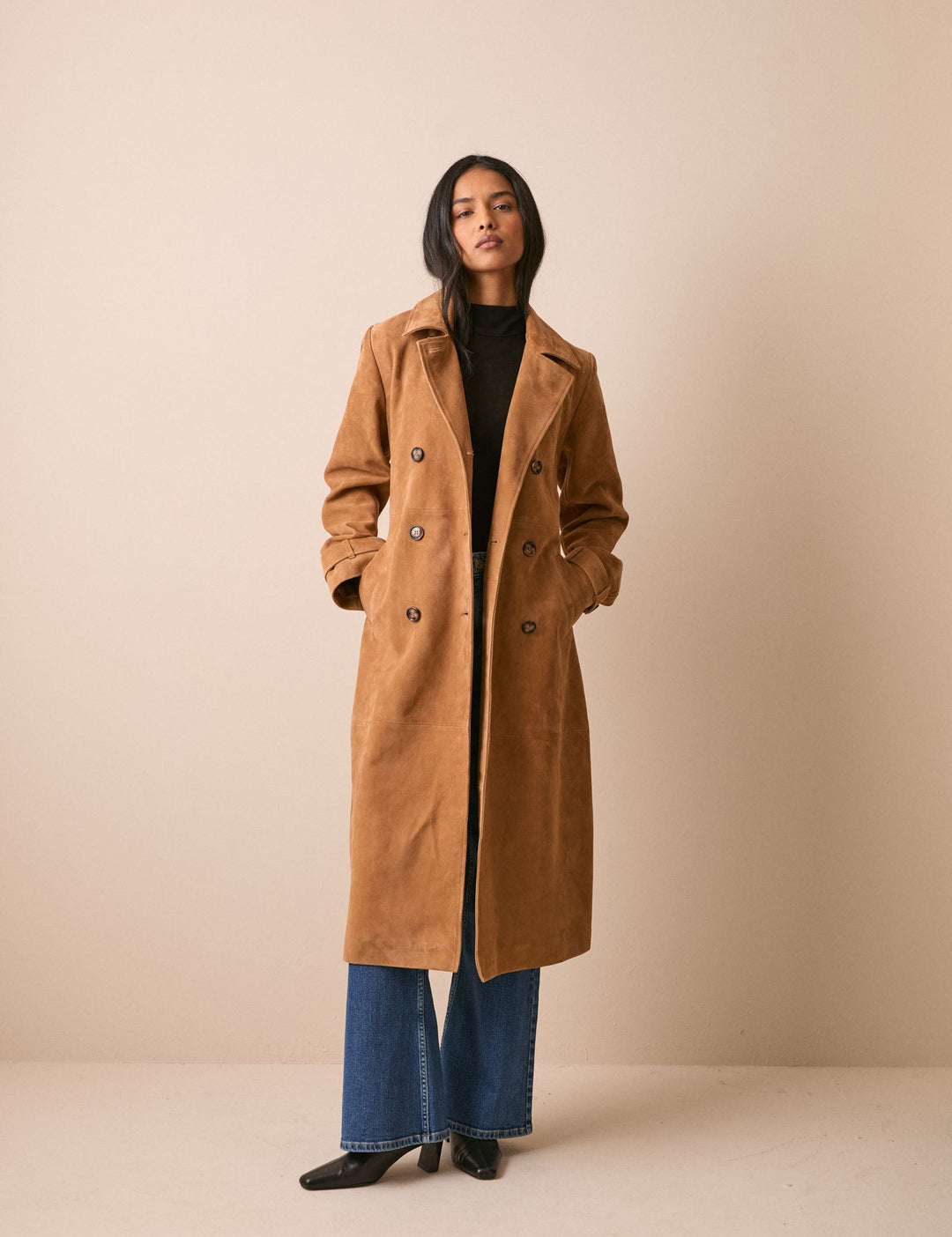 Women's brown belted trench coat with notched collar and long sleeves