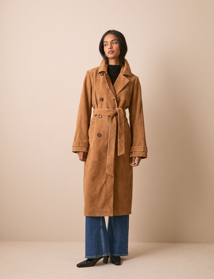 Women's brown belted trench coat with notched collar and long sleeves